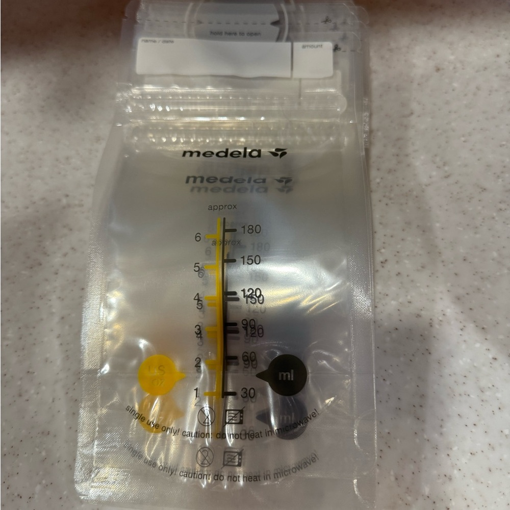 Medela Clear Milk Storage Bags with Yellow and Black Accents